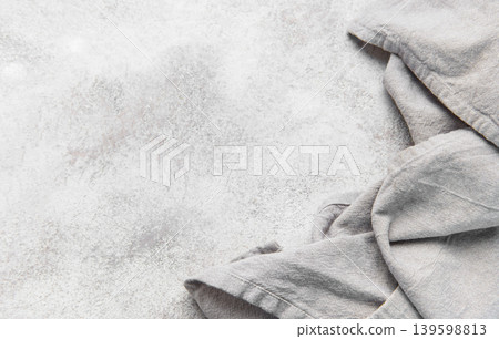 Gray kitchen textile on textured grunge counter background Gray kitchen textile on textured grunge counter background 139598813