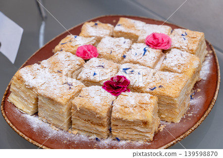 Sliced Napoleon cake with layered puff pastry and cream Sliced Napoleon cake with layered puff pastry and cream 139598870