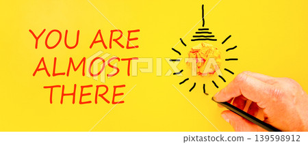 You are almost there words symbol. Concept words You are almost there on beautiful yellow paper. Beautiful yellow background. Business You are almost there motivational support concept. Copy space. 139598912