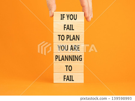 Planning to fail symbol. Concept words If you fail to plan you are planning to fail on beautiful wooden blocks. Beautiful orange paper background. Business planning to fail concept. Copy space. Planning to fail symbol. Concept words If you fail to plan you are planning to fail on beautiful wooden blocks. Beautiful orange paper background. Business planning to fail concept. Copy space. 139598993
