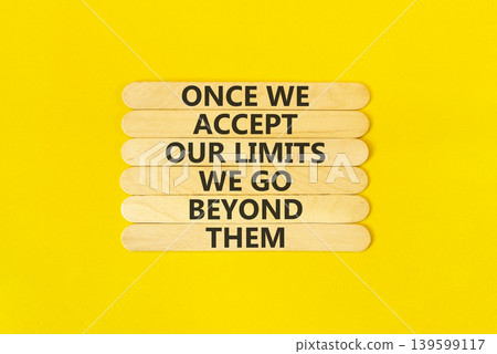 Beyond limits symbol. Concept words Once we accept our limits we go beyond them on wooden Sticks. Beautiful orange background. Business Once we accept our limits we go beyond them concept. Copy space. Beyond limits symbol. Concept words Once we accept our limits we go beyond them on wooden Sticks. Beautiful orange background. Business Once we accept our limits we go beyond them concept. Copy space. 139599117