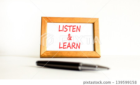 Listen and learn words symbol. Concept words Listen and learn on beautiful wooden picture frame. Beautiful white background. Business listen and learn support concept. Copy space. Listen and learn words symbol. Concept words Listen and learn on beautiful wooden picture frame. Beautiful white background. Business listen and learn support concept. Copy space. 139599158