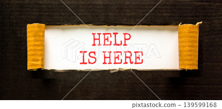 Help is here and support words symbol. Concept words Help is here on beautiful white paper. Beautiful black background. Business help is here and support concept. Copy space. 139599168