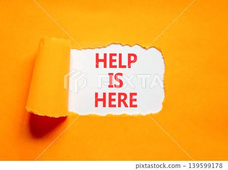 Help is here and support words symbol. Concept words Help is here on beautiful white paper. Beautiful orange background. Business help is here and support concept. Copy space. Help is here and support words symbol. Concept words Help is here on beautiful white paper. Beautiful orange background. Business help is here and support concept. Copy space. 139599178