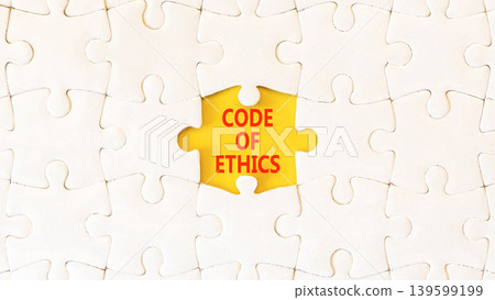 Code of ethics words symbol. Concept words Code of ethics on beautiful yellow paper. Beautiful white puzzles background. Business Code of ethics concept. Copy space. Code of ethics words symbol. Concept words Code of ethics on beautiful yellow paper. Beautiful white puzzles background. Business Code of ethics concept. Copy space. 139599199