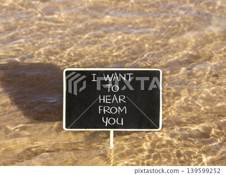 I want to hear from you symbol. Concept words I want to hear from you on beautiful black blackboard. Beautiful sea water background. Business support I want to hear from you concept. Copy space. I want to hear from you symbol. Concept words I want to hear from you on beautiful black blackboard. Beautiful sea water background. Business support I want to hear from you concept. Copy space. 139599252