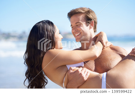 Smile, love and carrying with couple on beach together form travel, romance or honeymoon in summer. Hawaii, earth or nature with young man and woman by sea or ocean for holiday, vacation or bonding Smile, love and carrying with couple on beach together form travel, romance or honeymoon in summer. Hawaii, earth or nature with young man and woman by sea or ocean for holiday, vacation or bonding 139599422