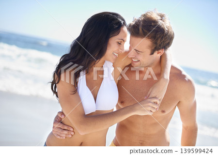 Embrace, smile and couple on beach for holiday adventure together on tropical island with blue sky. Happiness, man and woman on ocean vacation with waves, hug and on romantic travel in Indonesia. Embrace, smile and couple on beach for holiday adventure together on tropical island with blue sky. Happiness, man and woman on ocean vacation with waves, hug and on romantic travel in Indonesia. 139599424