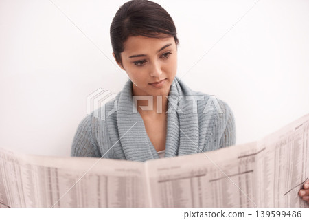 Indian woman, reading and newspaper in a home in the morning with story, article and news. Relax, press print and calm female person with paper publication and media in a house with information Indian woman, reading and newspaper in a home in the morning with story, article and news. Relax, press print and calm female person with paper publication and media in a house with information 139599486