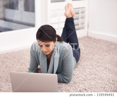 Woman on carpet with laptop, search and relax with studying, college research and browse on web in living room. University student girl on floor with computer, elearning and online education in home. Woman on carpet with laptop, search and relax with studying, college research and browse on web in living room. University student girl on floor with computer, elearning and online education in home. 139599491