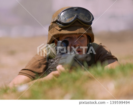 Military, warrior and aim with man and gun in nature for war, conflict and patriotism. Army, surveillance and security with person and sniper rifle training for soldier, battlefield and veteran Military, warrior and aim with man and gun in nature for war, conflict and patriotism. Army, surveillance and security with person and sniper rifle training for soldier, battlefield and veteran 139599494