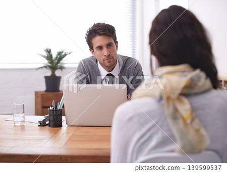 Coworkers, laptop and office with interview, conversation and technology in workplace. Man, woman and businesspeople with manager, team or recruitment with discussion, mentor and professional 139599537