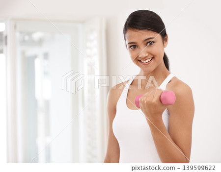 Woman, portrait and dumbbells for fitness at gym, workout and strong biceps or muscle growth. Happy female person, smiling and weightlifting or exercise and training, equipment and tools for athlete Woman, portrait and dumbbells for fitness at gym, workout and strong biceps or muscle growth. Happy female person, smiling and weightlifting or exercise and training, equipment and tools for athlete 139599622