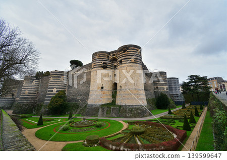 The walls of Angers Castle in France: A medieval fortress standing under a cloudy sky (December 26, 2023) 139599647