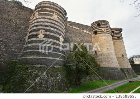 The walls of Angers Castle in France: A medieval fortress standing under a cloudy sky (December 26, 2023) The walls of Angers Castle in France: A medieval fortress standing under a cloudy sky (December 26, 2023) 139599653