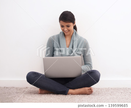 Happy woman, laptop and relax on floor for communication, email or online research at home. Young female person or freelancer smile in remote work on computer for search, networking or streaming 139599685