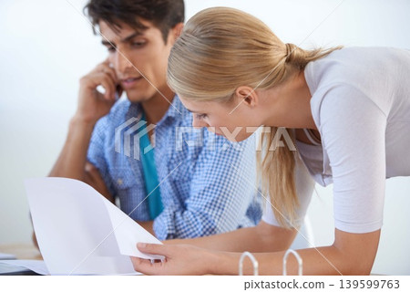 Serious, business meeting and phone call with documents, teamwork and planning strategy with workers or assistant. Man, woman and tech for work project, conversation and workplace efficiency Serious, business meeting and phone call with documents, teamwork and planning strategy with workers or assistant. Man, woman and tech for work project, conversation and workplace efficiency 139599763