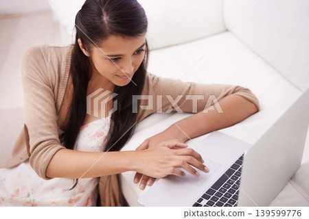 Girl on sofa with laptop, search and relax with remote work, website and browse in living room. Woman on couch with computer for freelance job, internet research and reading email online in home. Girl on sofa with laptop, search and relax with remote work, website and browse in living room. Woman on couch with computer for freelance job, internet research and reading email online in home. 139599776