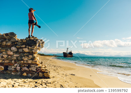 Tourist take photo on beach sea shore Tourist take photo on beach sea shore 139599792