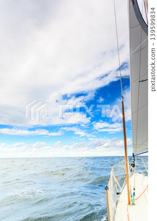 Yachting on sail boat during sunny weather Yachting on sail boat during sunny weather 139599834