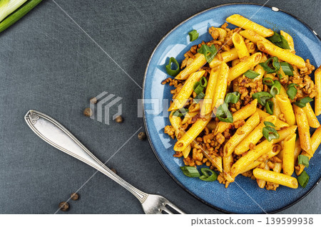 Homemade penne with fried ground meat and herbs 139599938