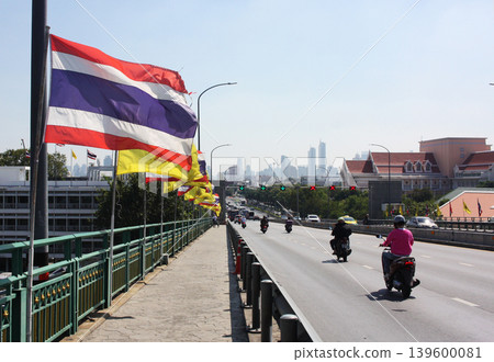National flag of Thailand against the background of the city. National flag of Thailand against the background of the city. 139600081