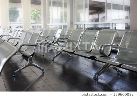 Waiting area with metal chairs in station, or bank, office, hospital Waiting area with metal chairs in station, or bank, office, hospital 139600082