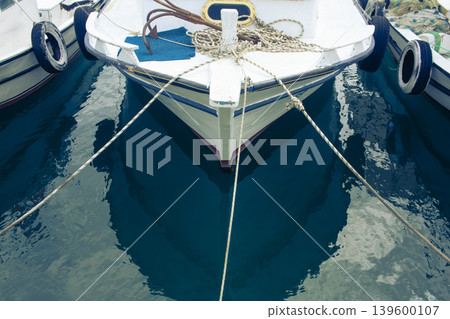 Fishing boat at the marina in the open sea. Trawler. Fishing and Sightseeing Boat Trips. 139600107