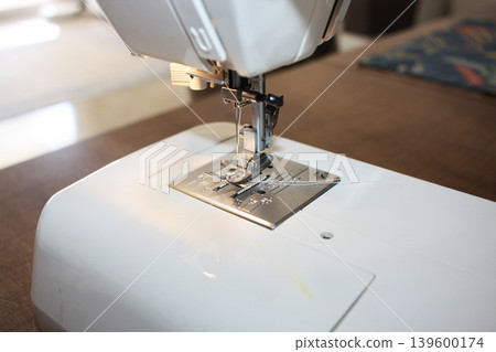 Sewing machine with needle and thread close-up. Sewing machine with needle and thread close-up. 139600174