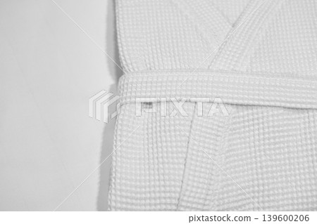 White clean terry bathrobe at the hotel 139600206