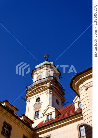 Astronomical Tower of the Klementinum in Prague with Atlant statue holding heavens, Czech Republic, clear blue sky, sunny day Astronomical Tower of the Klementinum in Prague with Atlant statue holding heavens, Czech Republic, clear blue sky, sunny day 139600270