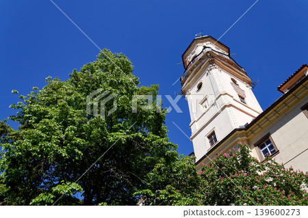Astronomical Tower of the Klementinum in Prague with Atlant statue holding heavens, Czech Republic, clear blue sky, sunny day Astronomical Tower of the Klementinum in Prague with Atlant statue holding heavens, Czech Republic, clear blue sky, sunny day 139600273
