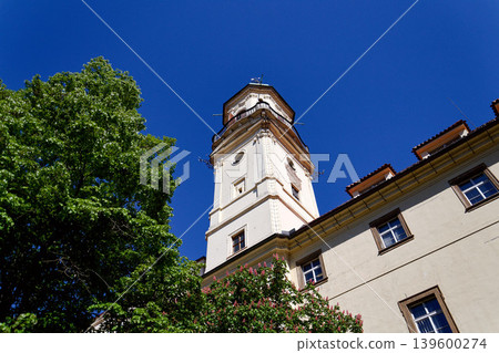 Astronomical Tower of the Klementinum in Prague with Atlant statue holding heavens, Czech Republic, clear blue sky, sunny day Astronomical Tower of the Klementinum in Prague with Atlant statue holding heavens, Czech Republic, clear blue sky, sunny day 139600274
