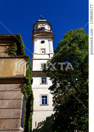 Astronomical Tower of the Klementinum in Prague with Atlant statue holding heavens, Czech Republic, clear blue sky, sunny day Astronomical Tower of the Klementinum in Prague with Atlant statue holding heavens, Czech Republic, clear blue sky, sunny day 139600277
