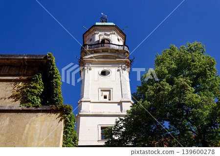 Astronomical Tower of the Klementinum in Prague with Atlant statue holding heavens, Czech Republic, clear blue sky, sunny day Astronomical Tower of the Klementinum in Prague with Atlant statue holding heavens, Czech Republic, clear blue sky, sunny day 139600278