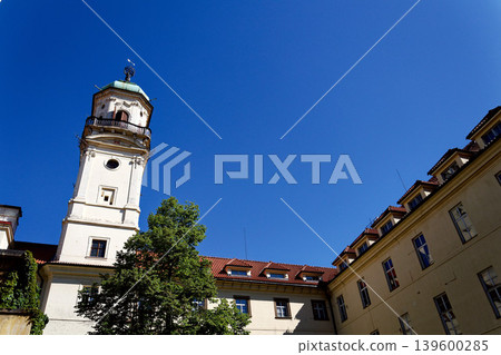 Astronomical Tower of the Klementinum in Prague with Atlant statue holding heavens, Czech Republic, clear blue sky, sunny day 139600285