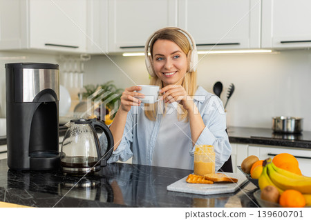 Young woman pouring morning coffee in home kitchen with toast and peanut butter breakfast aroma joy 139600701
