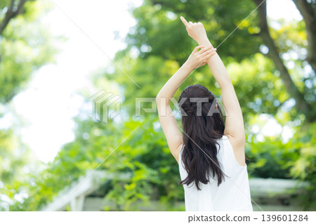 A woman relaxing in the park A woman relaxing in the park 139601284