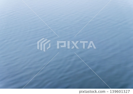 Spring waterside: Ripples from raindrops falling on the water's surface 01 Spring waterside: Ripples from raindrops falling on the water's surface 01 139601327