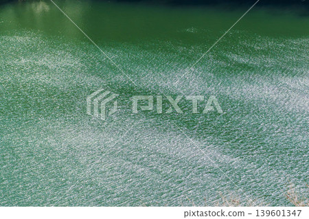 The lake sparkles in the spring sunshine. The lake sparkles in the spring sunshine. 139601347