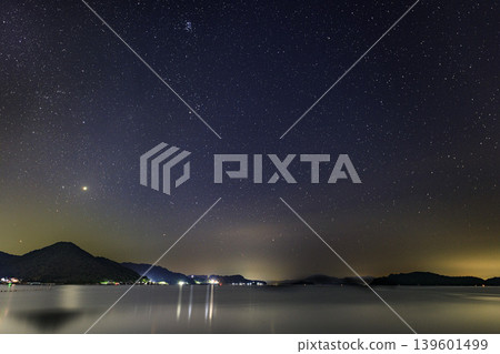 Summer starry sky over the Seto Inland Sea: The rising constellations Orion and Taurus Summer starry sky over the Seto Inland Sea: The rising constellations Orion and Taurus 139601499