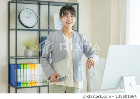 Young business woman in the office 139601664