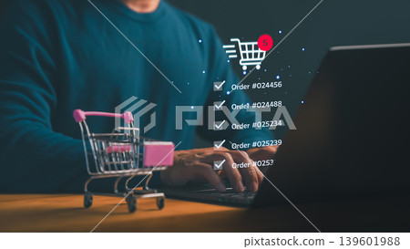 Man using laptop for online shopping and e-commerce. Digital retail business technology with shopping cart icon and order tracking via internet. Man using laptop for online shopping and e-commerce. Digital retail business technology with shopping cart icon and order tracking via internet. 139601988