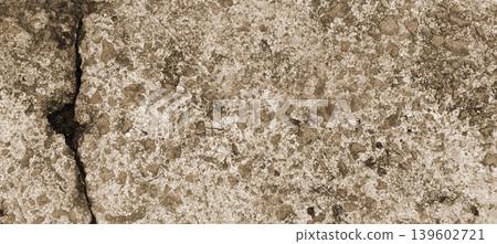 Close-up Texture of a Cracked Concrete Surface Background 139602721