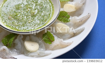 shrimp in fish sauce with Thai spicy seafood dipping sauce on white plate 139603612