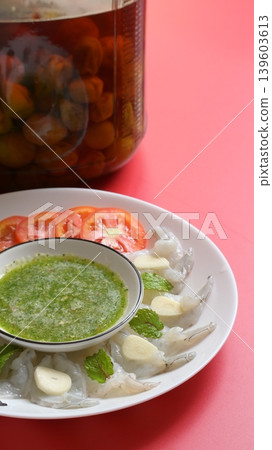 shrimp in fish sauce with Thai spicy seafood dipping sauce on white plate and umeshu 139603613