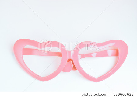 pink heart shape of glasses on white background 139603622