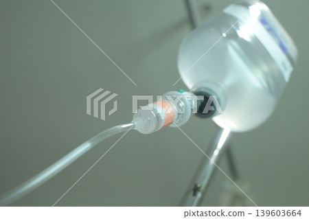 saline solution drip for patient and infusion pump in hospital, close up equipment of medicine saline solution drip for patient and infusion pump in hospital, close up equipment of medicine 139603664