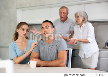 Old couple quarrel with young couple Old couple quarrel with young couple 139604463