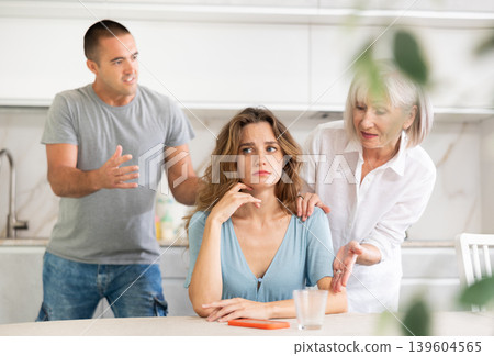 Young girl with her mother-in-law and husband Young girl with her mother-in-law and husband 139604565